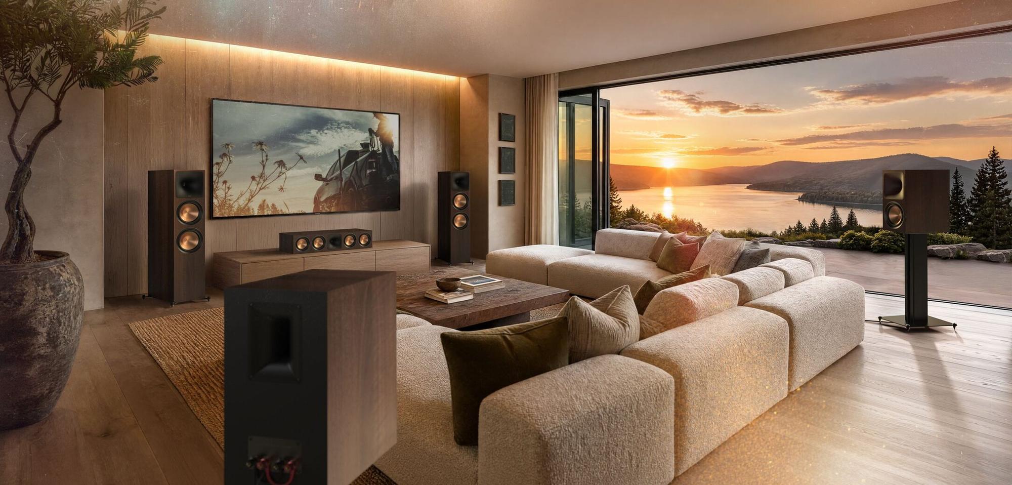 Klipsch home theater system in a living room overlooking a lake at sunset
