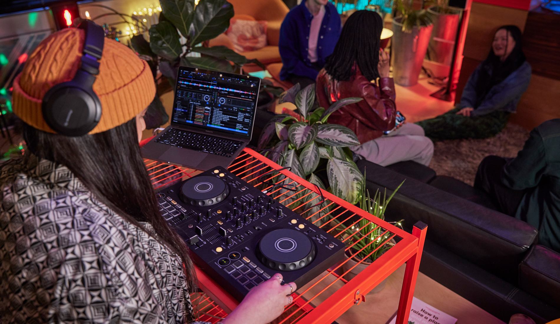 Pioneer DJ DDJ-FLX10 performance controller lit in a dark studio